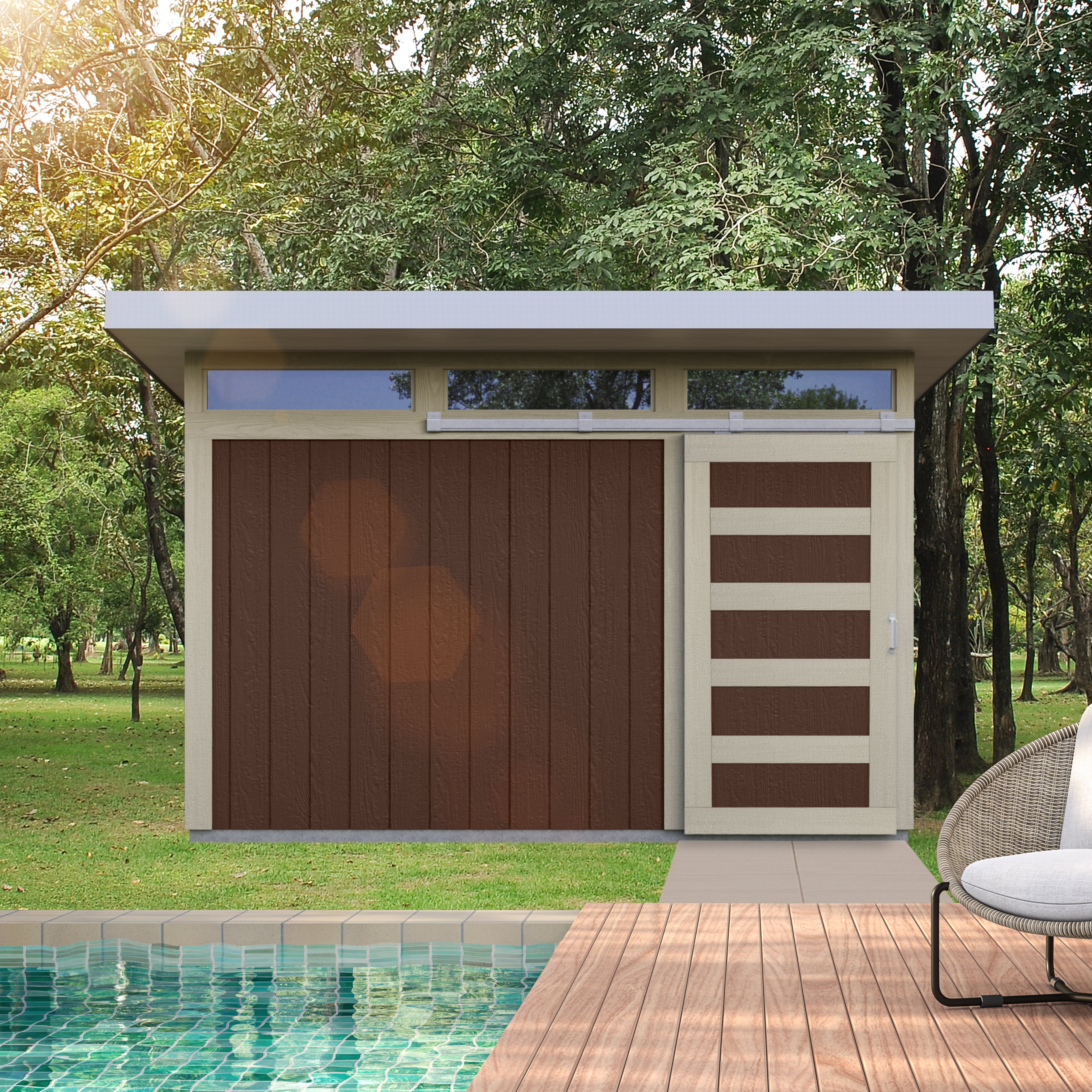 Sleek modern storage shed with a brown sliding barn door, set in a lush outdoor space by the pool.