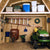 Storage loft for shed organization with tractor, wheelbarrows and tools